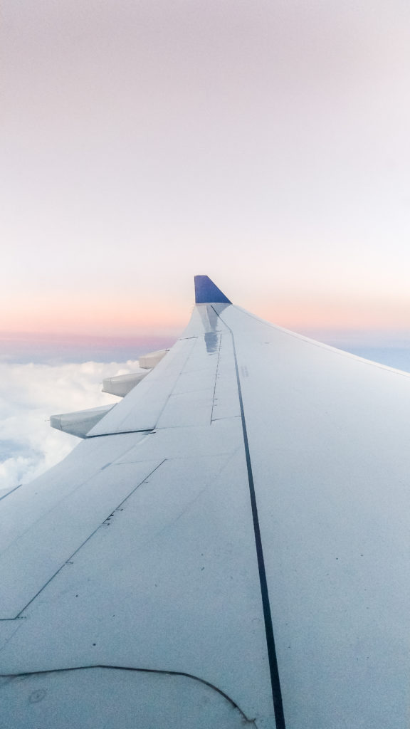 Plane window at sunrise