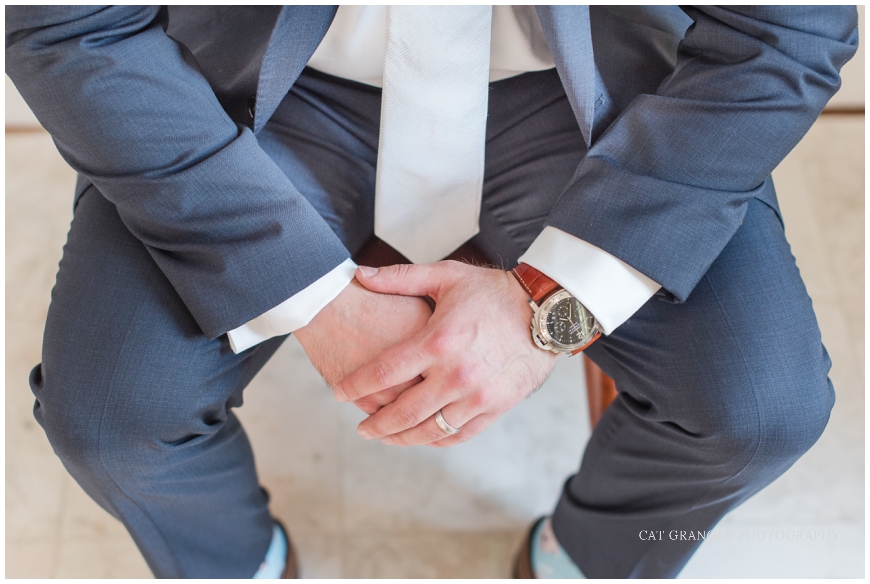 TPC POTOMAC WEDDING  groom watch photo with navy suit