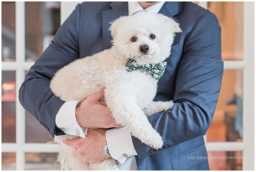 TPC POTOMAC WEDDING  groom with white fluffy dog 