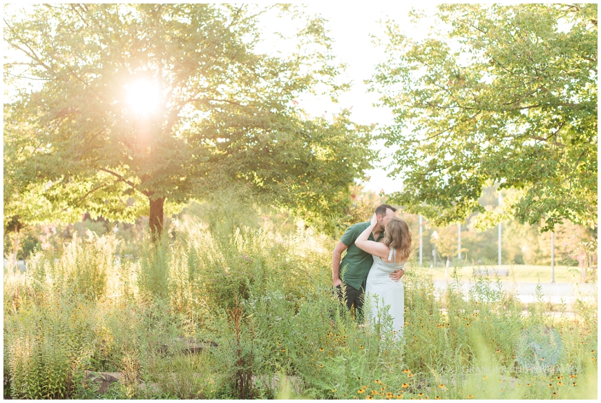 couple embracing at picturesque susnet