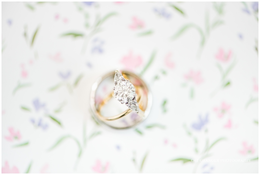 wedding rings with floral background