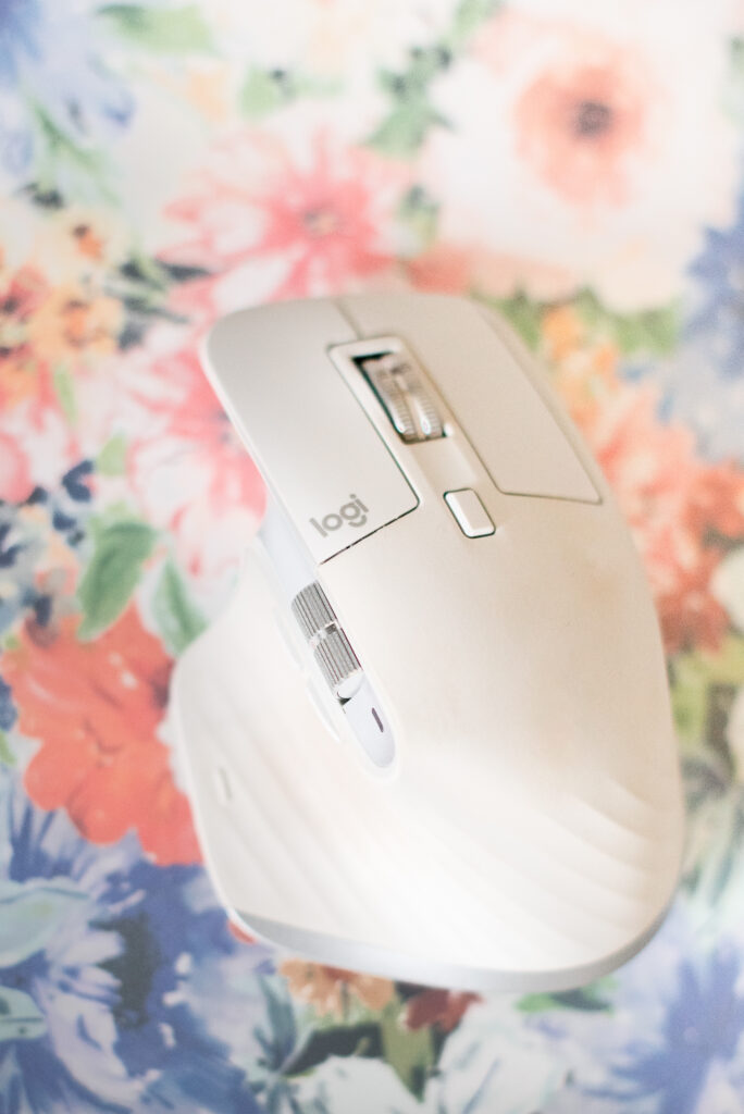 Logitech MX Master Mouse in white on floral background