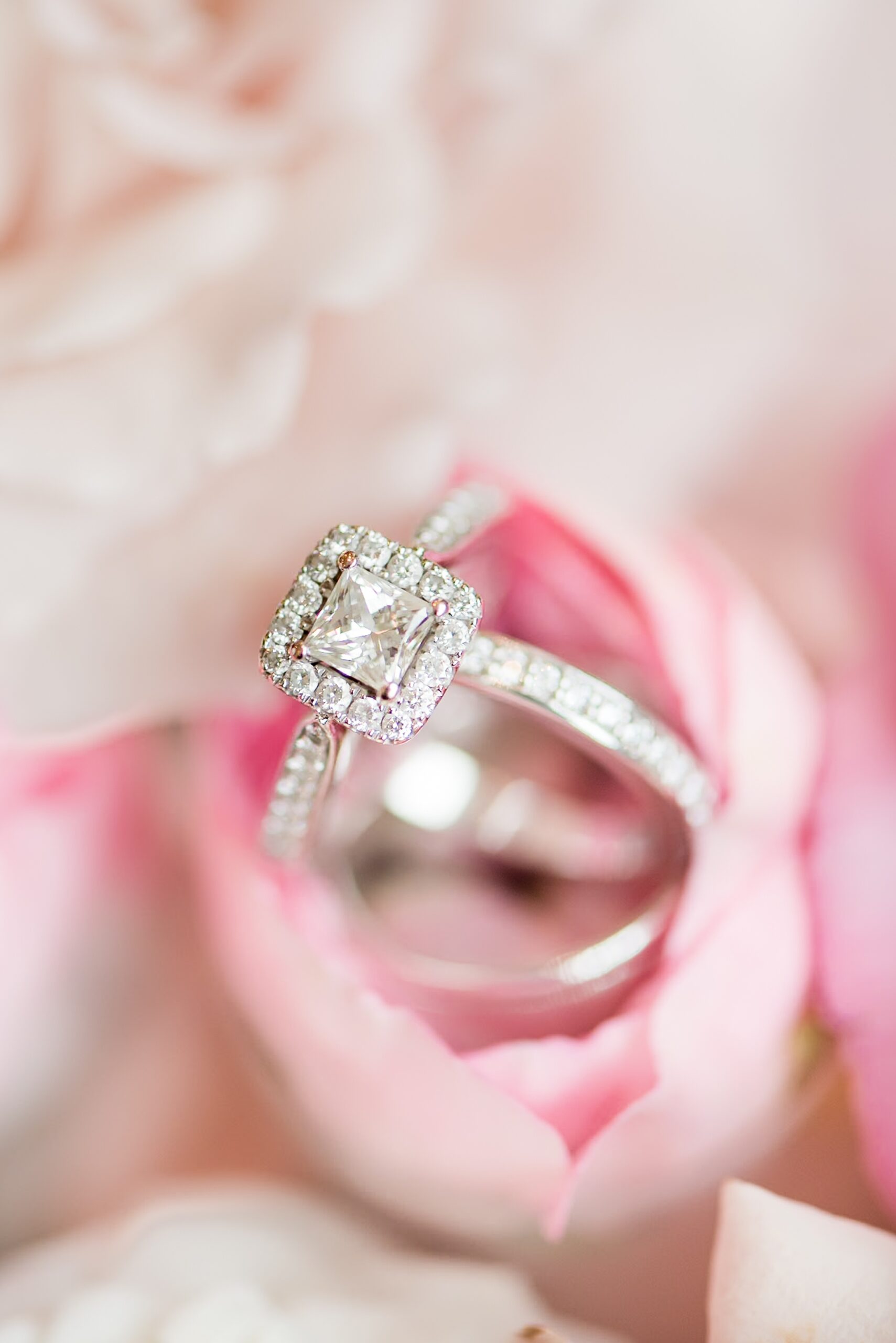 Details of an engagement ring and wedding band in a pink rose at one of the Baltimore Country Club Weddings