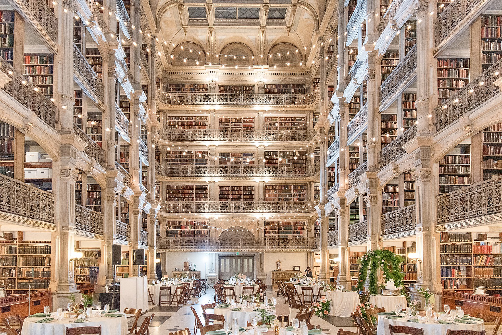 A view of a wedding reception set up at the George Peabody Library Wedding venue