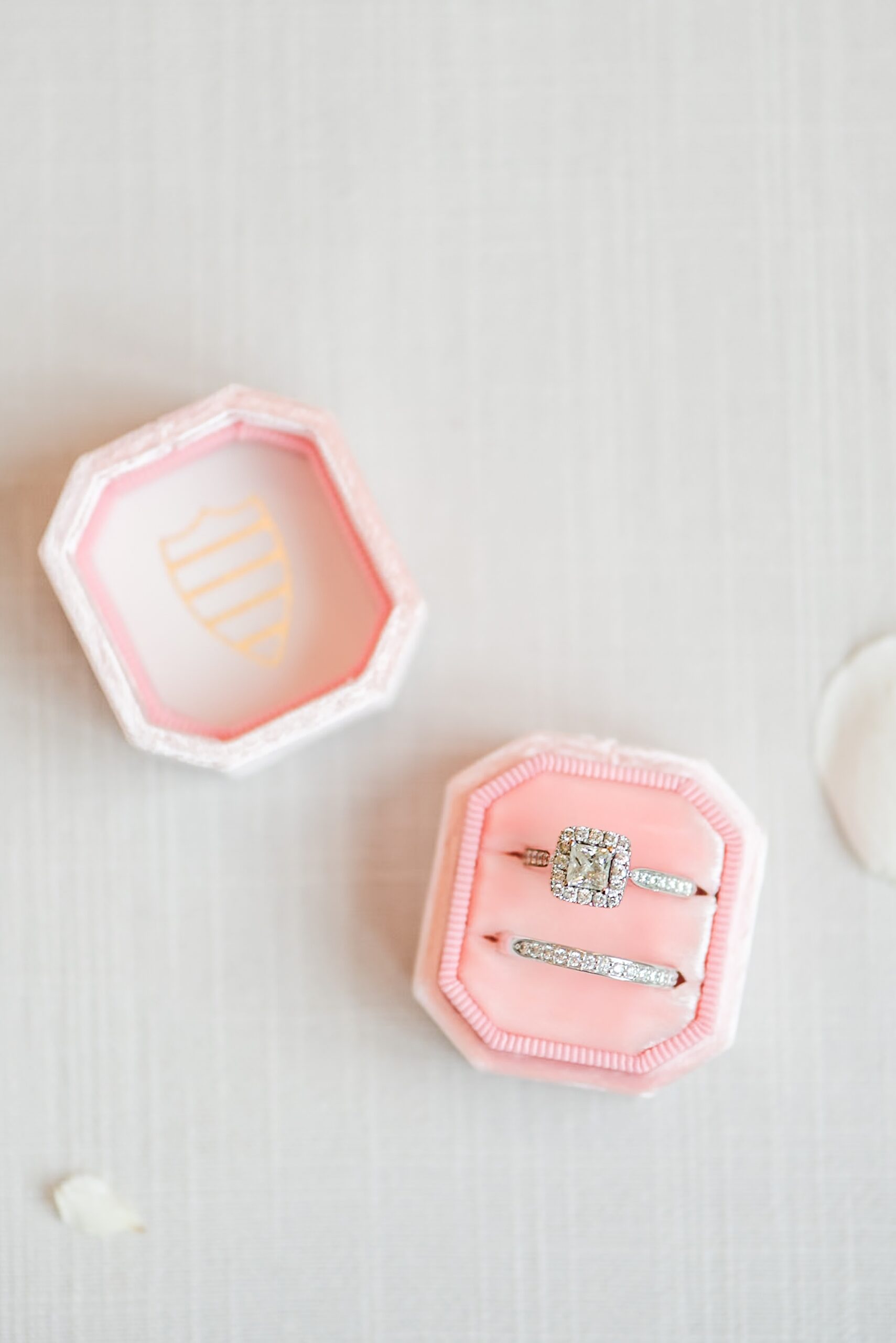 Details of bridal rings in a pink ring box at a Gramercy Mansion wedding