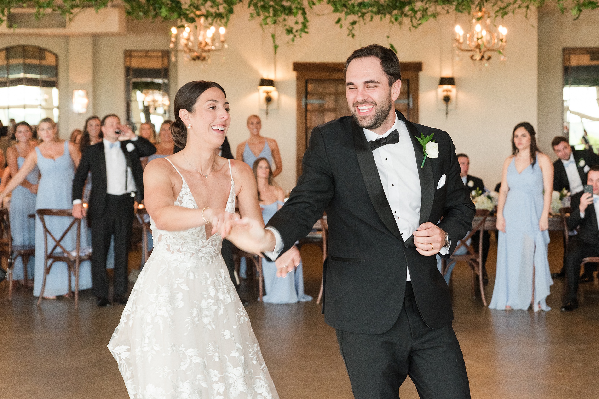 Newlyweds dance and laugh at their Kentlands Mansion Wedding ceremony
