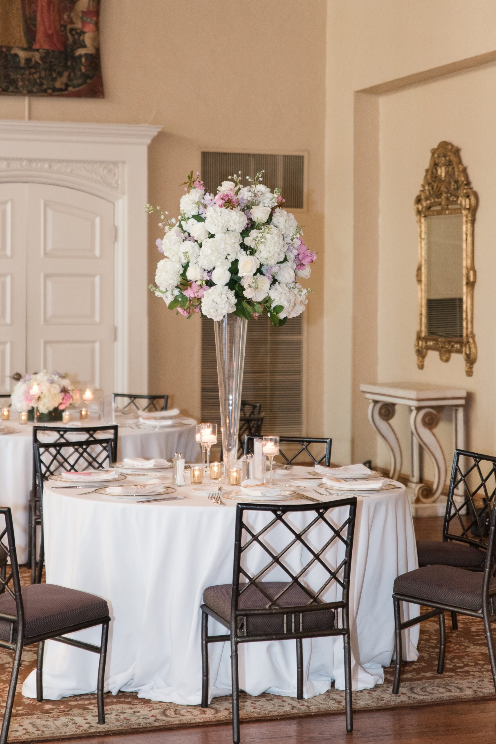 Details of a tall wedding reception centerpiece with white and purple flowers at a Congressional Country Club Wedding