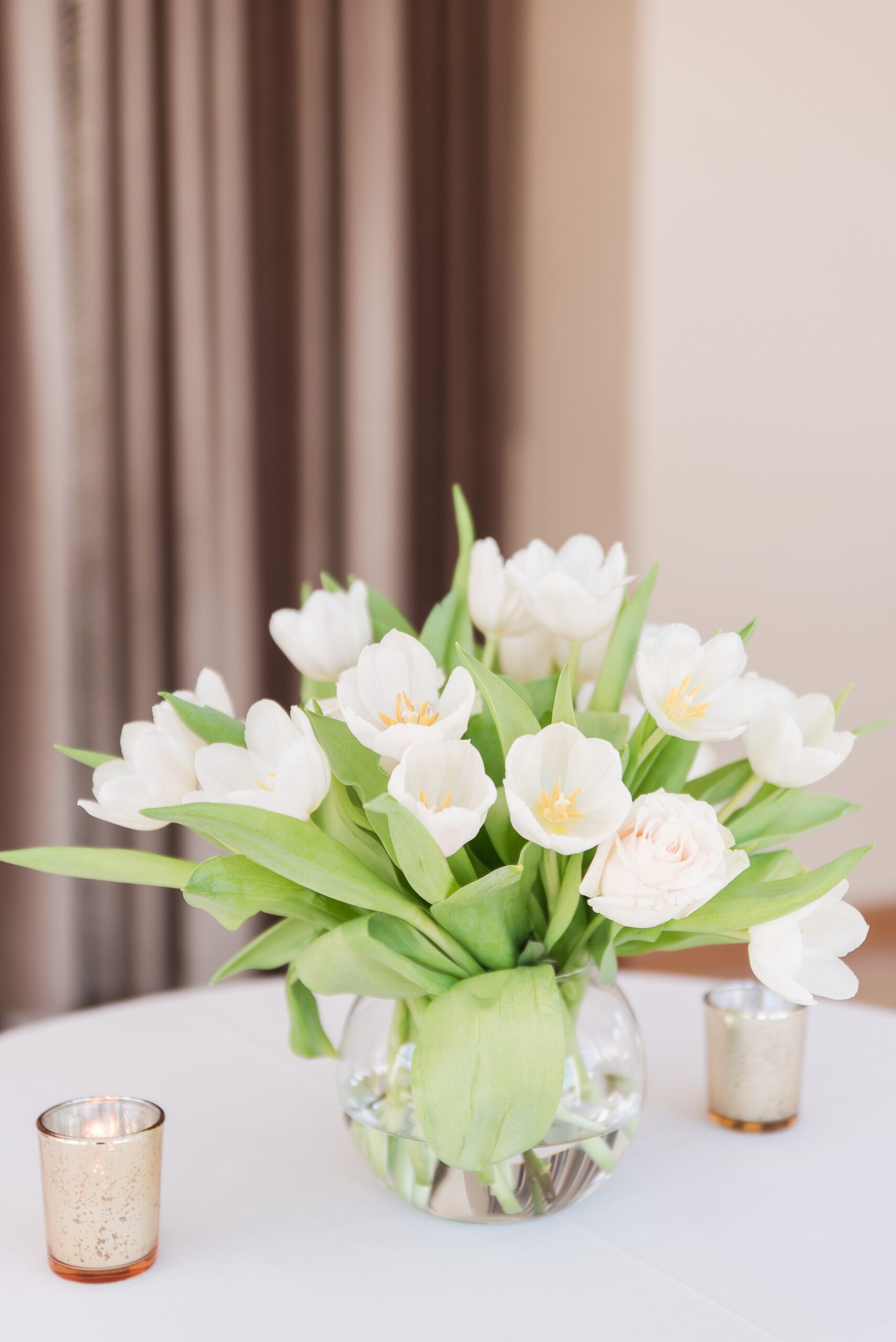 Details of a white tulip wedding reception centerpiece