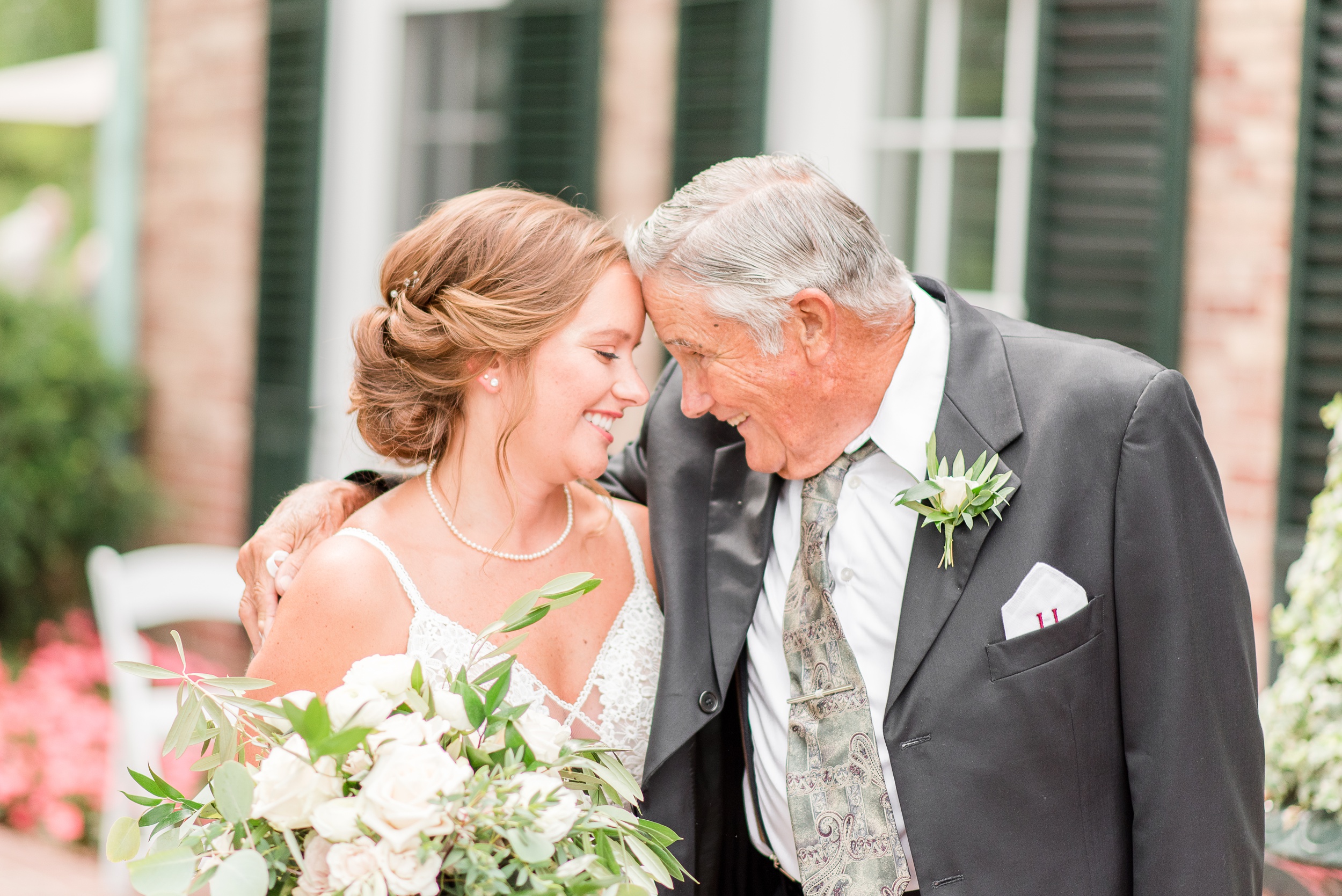 A bride shares a special moment with her grandfather