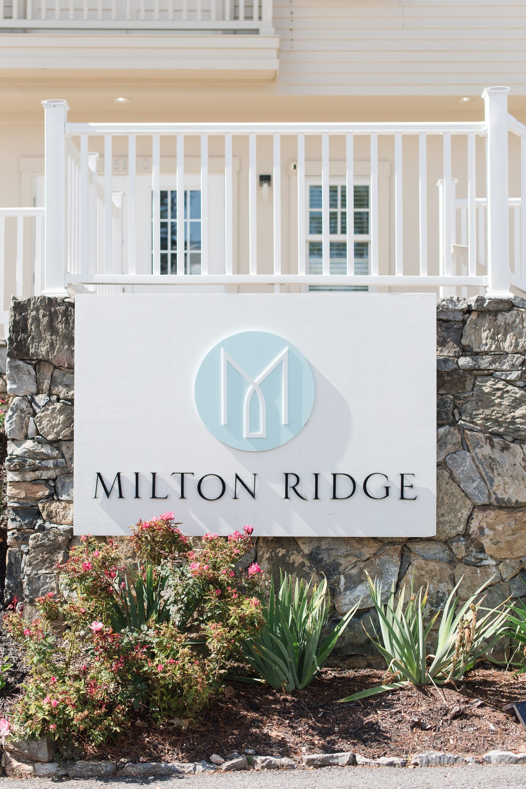 Details of the Milton Ridge Wedding venue sign on a stone wall