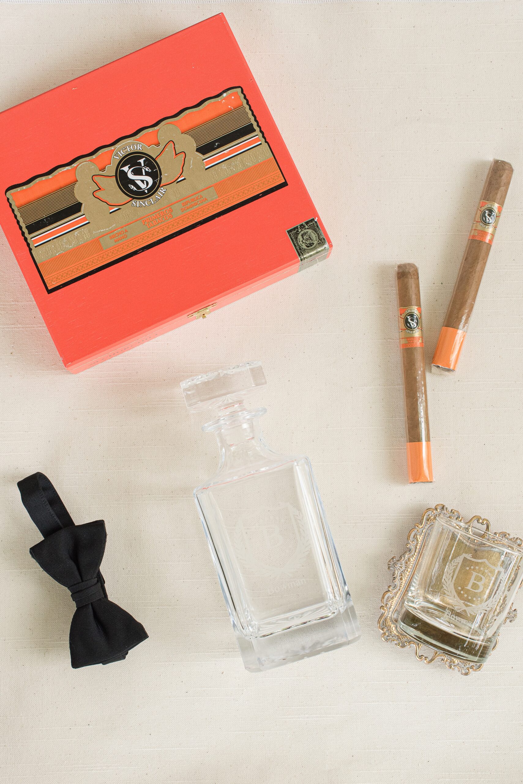 Wedding Details with cigars cologne and a bowtie
