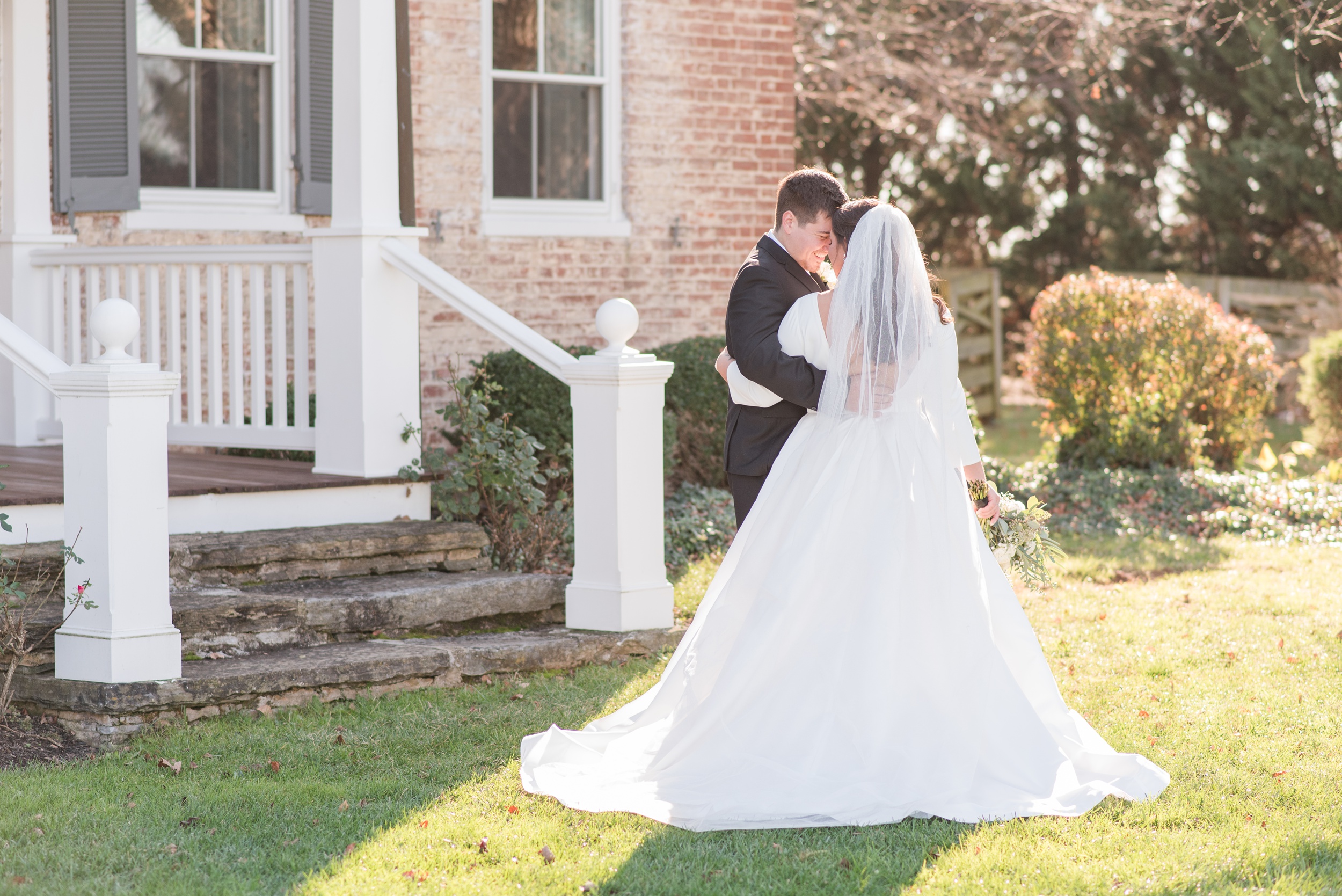 Newlyweds share an intimate happy moment in a garden at their Walkers Overlook Wedding
