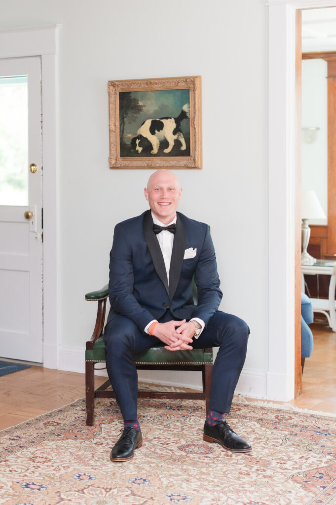 groom in farmhouse on wedding day