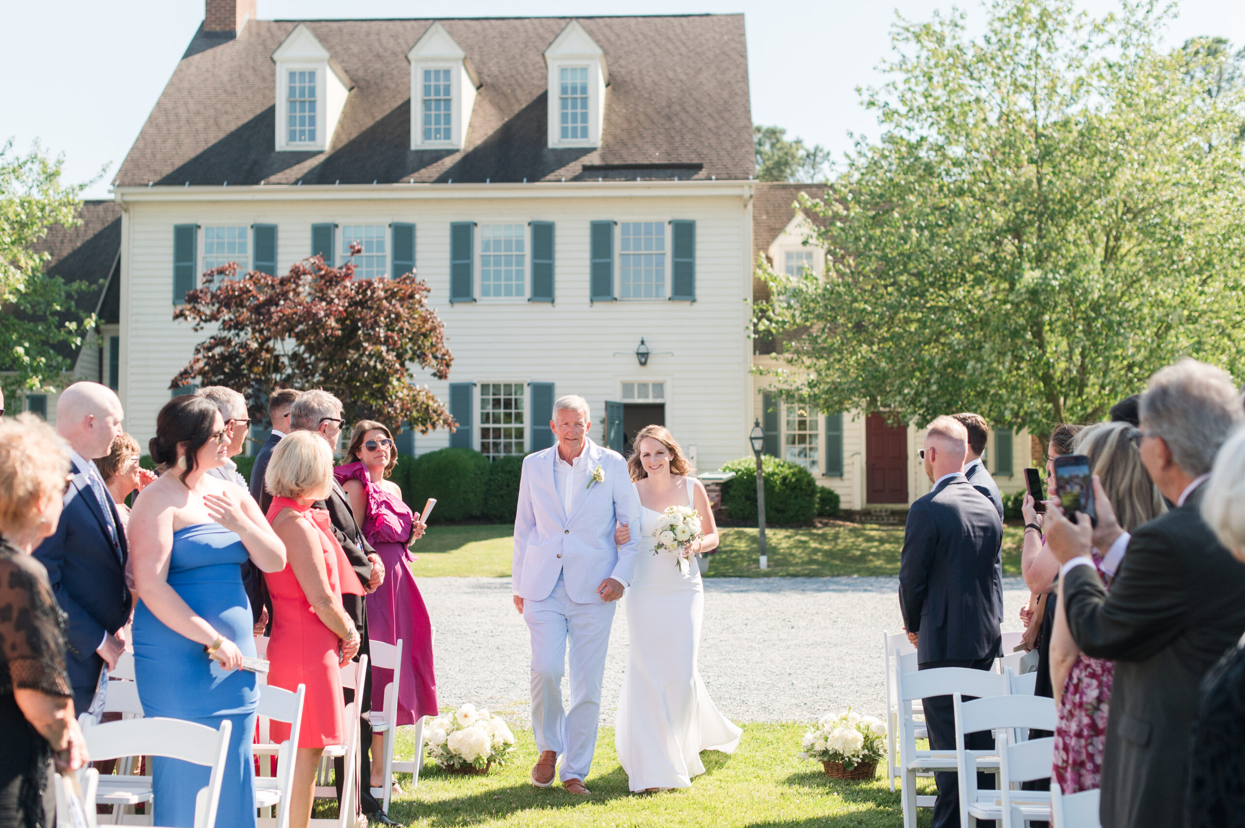 bride walking down the aisle at osprey point inn