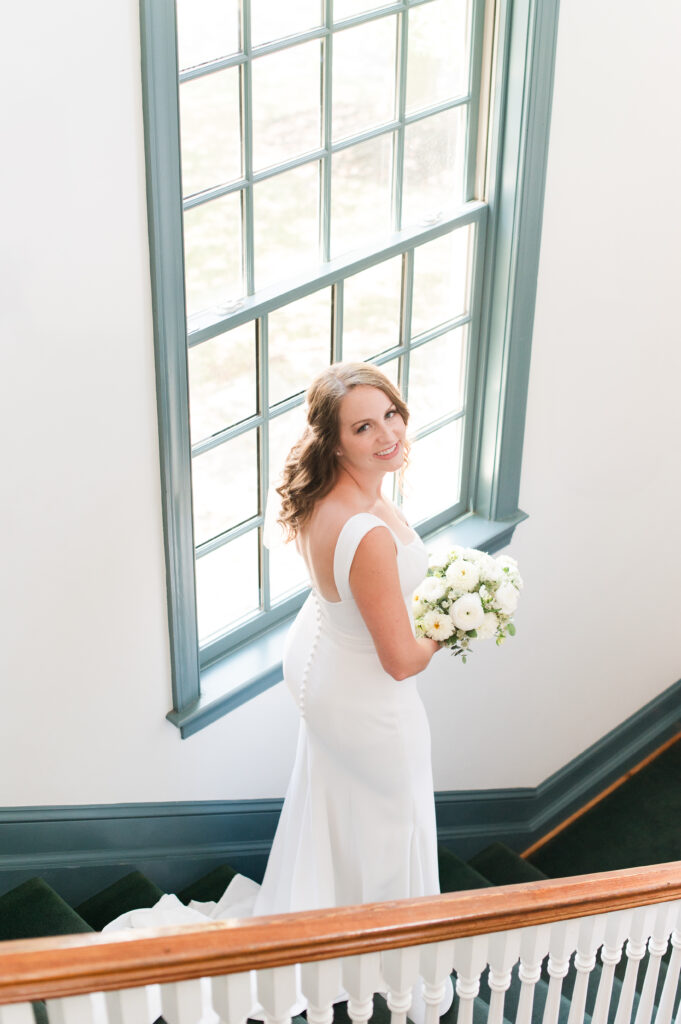 bride going down the stairs on wedding day