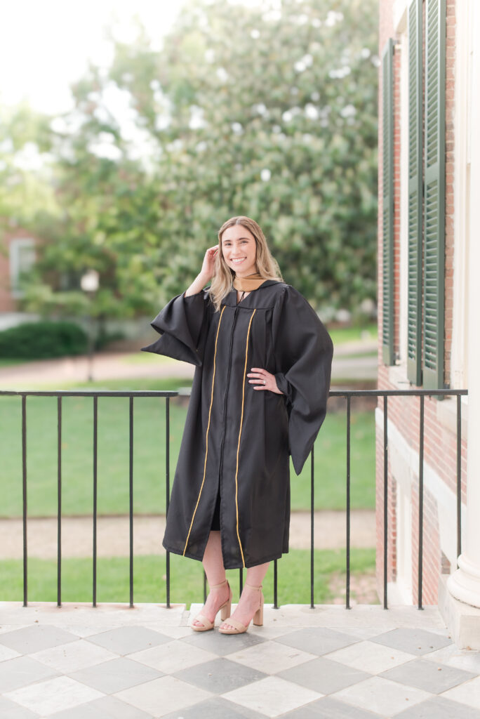 black cap and gown female grad student in baltimore